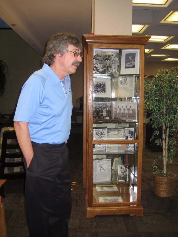 Rice stands before a display of some of his Sockalexis memorabilia.